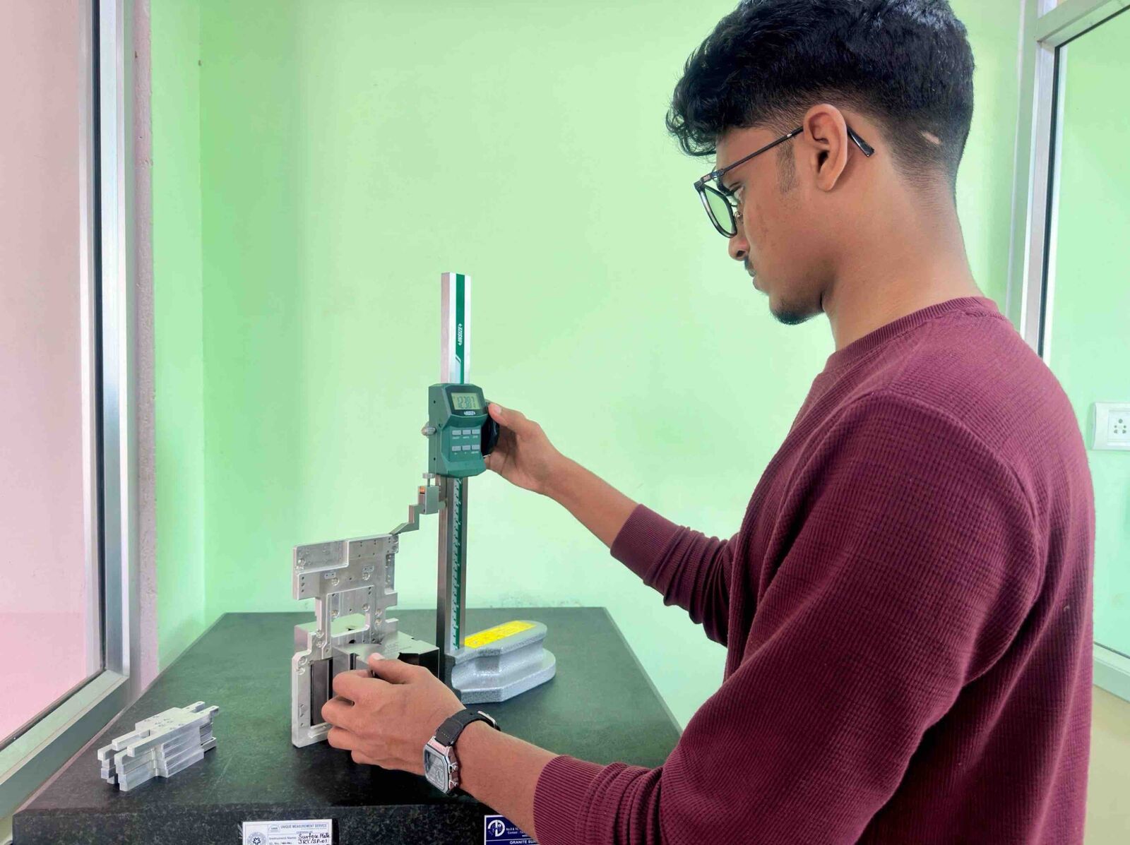 Digital height gauge inspection on granite surface plate